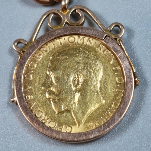 277 - George V gold sovereign dated 1911, in 9ct gold ornate pendant mount on 9ct rose gold curb-link chai... 