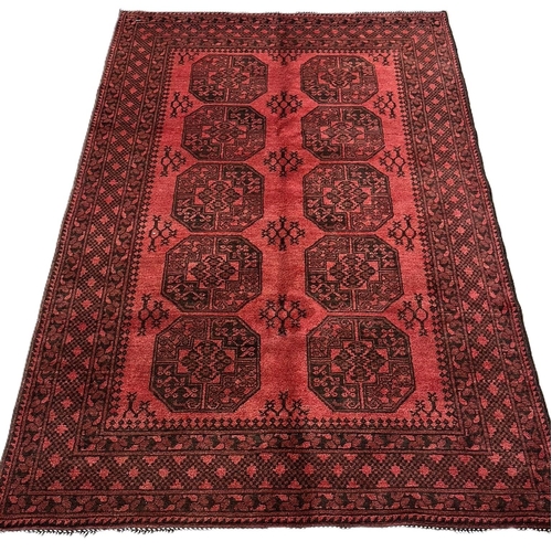 310 - Hand woven Afghan double knot red ground rug, with traditional Bokhara design. 250x160cm approx.  (B... 