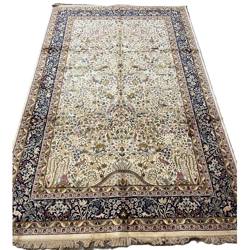 324 - Ivory ground full pile kasmir 'Tree of Life' design rug. 308x193cm approx.  (B.P. 21% + VAT)