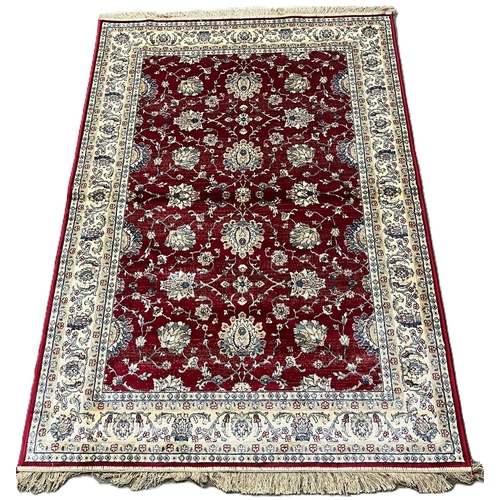 327 - Rich red ground full pile Kasmir rug, with floral Ziegler design. 178x117cm approx. (B.P. 21% + VAT)