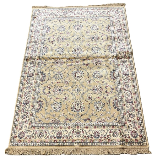 328 - Pale gold ground full pile Kasmir rug, with all over floral Ziegler design. 180x117cm approx. (B.P. ... 