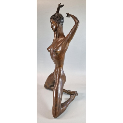 46 - Patinated bronze full length female nude study of a kneeling young woman with outstretched arms. Ind... 