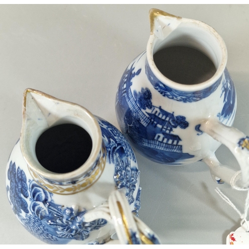 55 - Two 19th century Chinese Export porcelain blue and white Sparrow beak baluster shaped cream jugs, wi... 