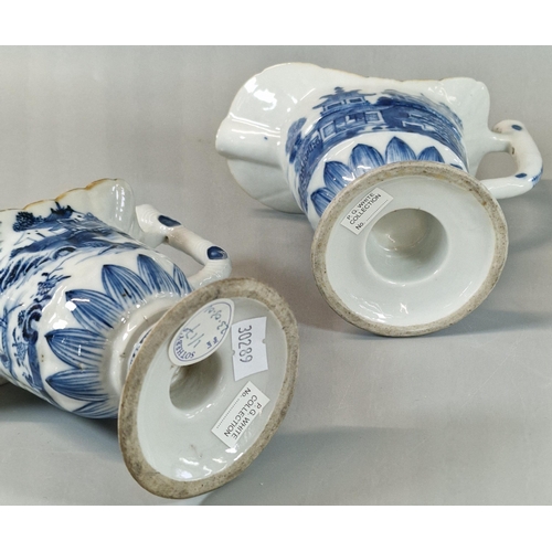 58 - Two similar Chinese Export porcelain helmet shaped pedestal jugs, each with continual blue and white... 