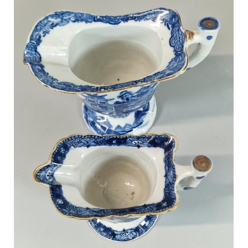 58 - Two similar Chinese Export porcelain helmet shaped pedestal jugs, each with continual blue and white... 