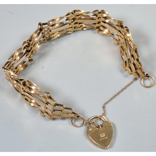 243 - 9ct gold five bar gate bracelet with heart shaped padlock. 10g approx. (B.P. 21% + VAT)