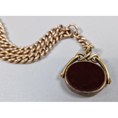 248 - 9ct gold curb-link watch chain with bloodstone revolving fob in 15ct mount. Total weight 40g approx.... 