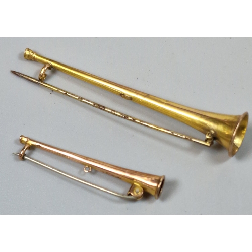 251 - Two 9ct gold hunting horn stock pins, the largest 7cm approx. 3.9g approx. (B.P. 21% + VAT)