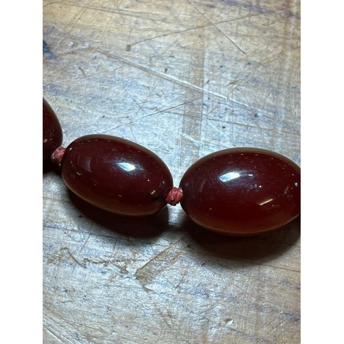 235 - 1930s Cherry Bakelite graduated beaded necklace. 50g approx. (B.P. 21% + VAT)