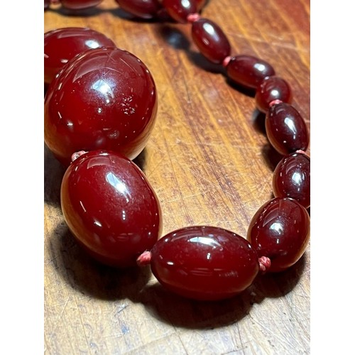 235 - 1930s Cherry Bakelite graduated beaded necklace. 50g approx. (B.P. 21% + VAT)