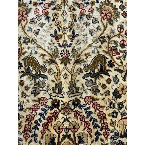 324 - Ivory ground full pile kasmir 'Tree of Life' design rug. 308x193cm approx.  (B.P. 21% + VAT)