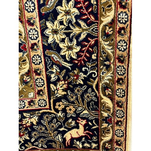 324 - Ivory ground full pile kasmir 'Tree of Life' design rug. 308x193cm approx.  (B.P. 21% + VAT)