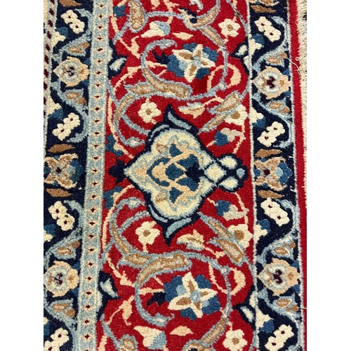 322 - Fine hand woven Persian Nian carpet with large central medallion design and flower and floral repeat... 