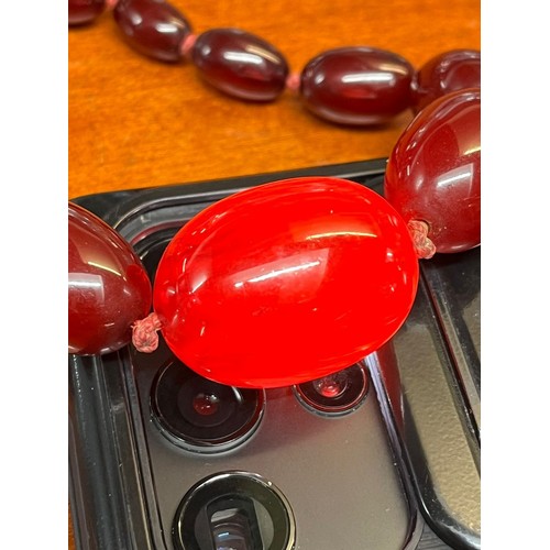 235 - 1930s Cherry Bakelite graduated beaded necklace. 50g approx. (B.P. 21% + VAT)