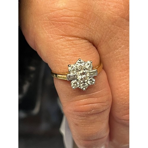 193 - 18ct gold and platinum diamond flowerhead ring, having seven brilliant round cut diamonds and two ba... 