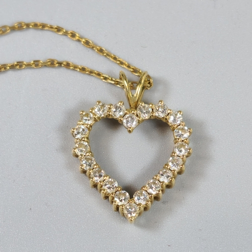 232 - Yellow metal open work heart shaped pendant featuring twenty round brilliant cut diamonds in claw se... 