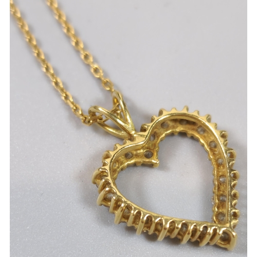 232 - Yellow metal open work heart shaped pendant featuring twenty round brilliant cut diamonds in claw se... 