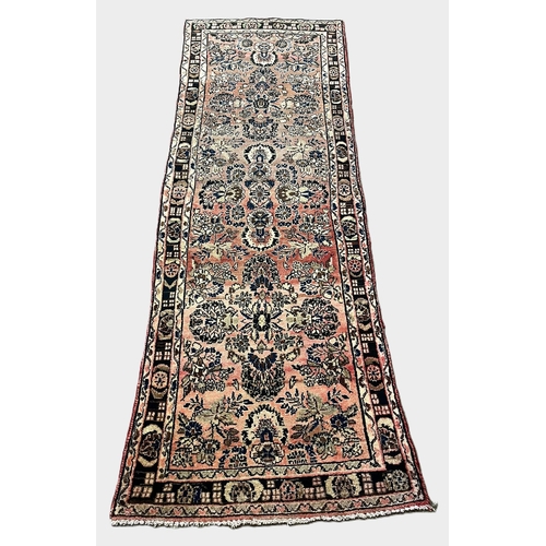 317 - Washed red ground hand woven Persian Hamadan Village runner. 289x96cm approx.  (B.P. 21% + VAT)