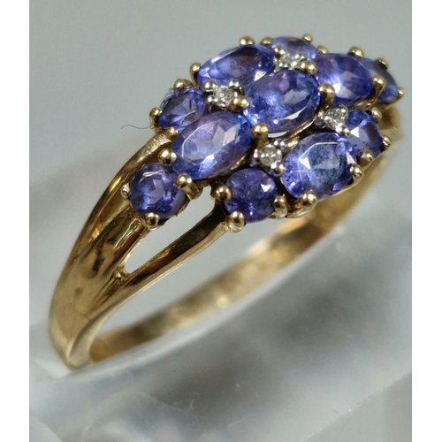 321 - 9ct gold purple stone cluster ring. 2.6g approx. Size P.  (B.P. 21% + VAT)