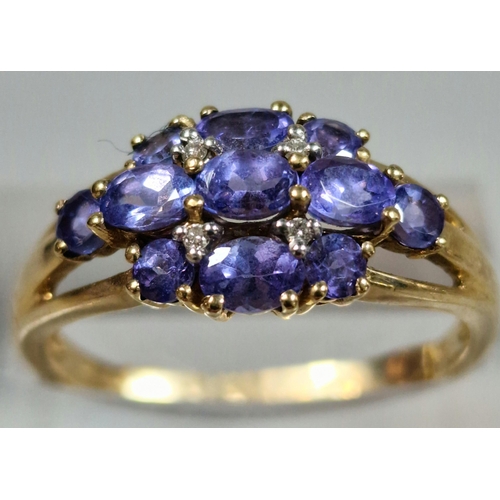 321 - 9ct gold purple stone cluster ring. 2.6g approx. Size P.  (B.P. 21% + VAT)