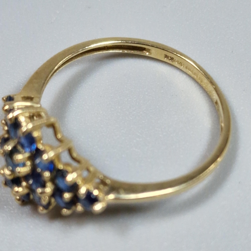 322 - 9ct gold blue stone cluster ring. 1.7g approx. Size Q. (B.P. 21% + VAT)