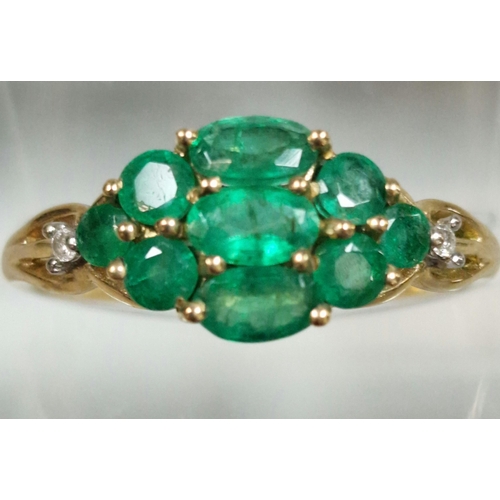 324 - 9ct gold multi-cluster green stone dress ring, inset with two tiny diamond chips. 2g approx. Size Q.... 