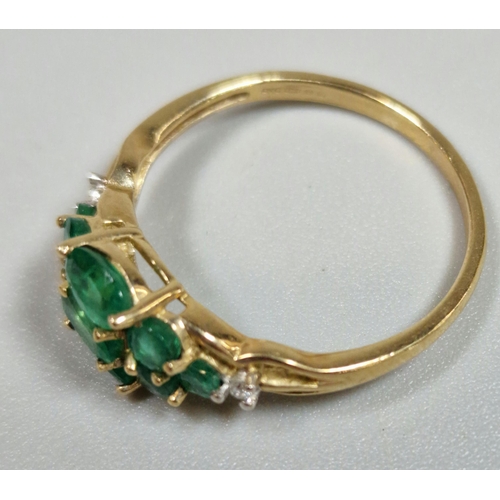 324 - 9ct gold multi-cluster green stone dress ring, inset with two tiny diamond chips. 2g approx. Size Q.... 