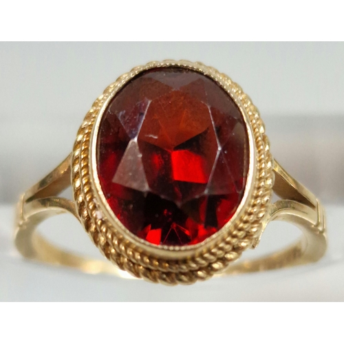 327 - 9ct gold red stone dress ring. 2.7g approx. Size J.  (B.P. 21% + VAT)