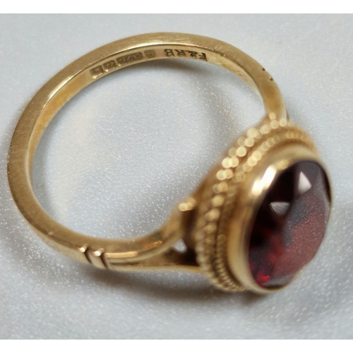 327 - 9ct gold red stone dress ring. 2.7g approx. Size J.  (B.P. 21% + VAT)