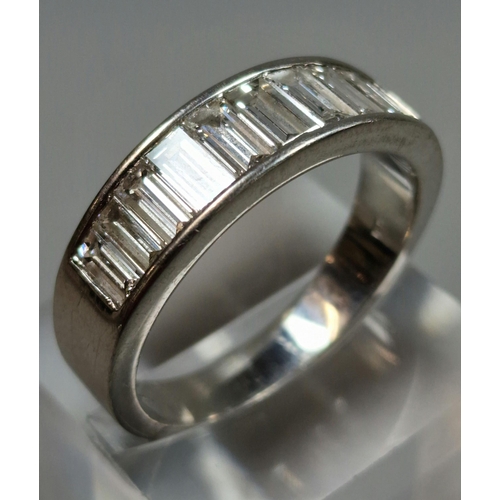 328 - Platinum eternity style ring, channel set with ten baguette diamonds. 12.8g approx. Size Y.  (B.P. 2... 