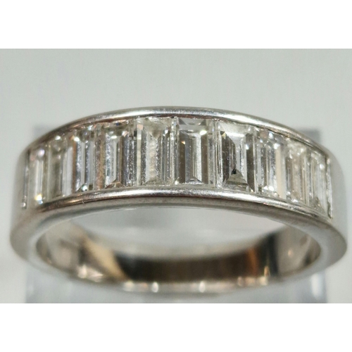 328 - Platinum eternity style ring, channel set with ten baguette diamonds. 12.8g approx. Size Y.  (B.P. 2... 