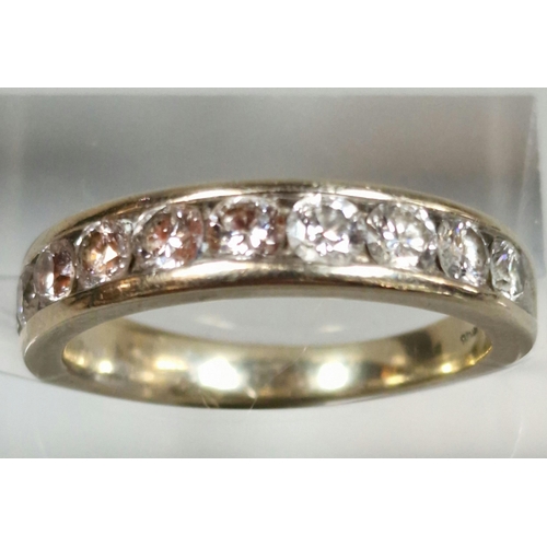 329 - 18ct white gold ten stone round brilliant cut diamond half eternity ring. 3.9g approx. Size K1/2.  (... 