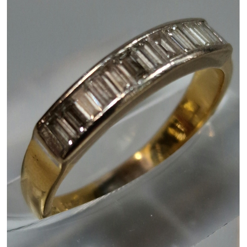 330 - 18ct gold half eternity ring, channel set with twelve baguette diamonds. 3.3g approx. Size M.  (B.P.... 