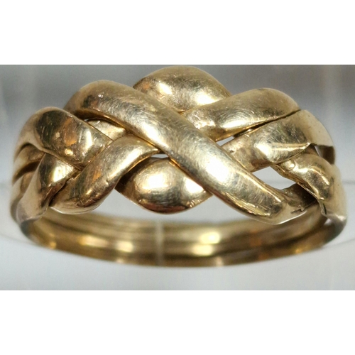 331 - 9ct gold puzzle style ring. 2.9g approx. Size P.  (B.P. 21% + VAT)