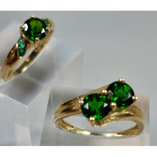 332 - Two similar 9ct gold green stone dress rings. 4.3g approx. Sizes N and O1/2. (2)  (B.P. 21% + VAT)