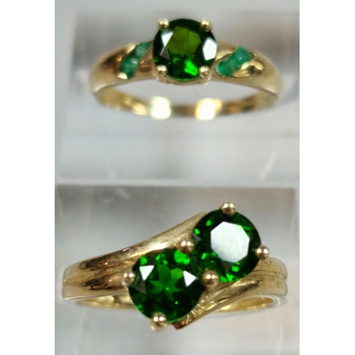 332 - Two similar 9ct gold green stone dress rings. 4.3g approx. Sizes N and O1/2. (2)  (B.P. 21% + VAT)