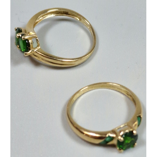 332 - Two similar 9ct gold green stone dress rings. 4.3g approx. Sizes N and O1/2. (2)  (B.P. 21% + VAT)