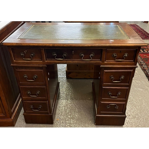 622 - Mahogany kneehole writing desk of small proportions with inset leather surface and an arrangement of... 