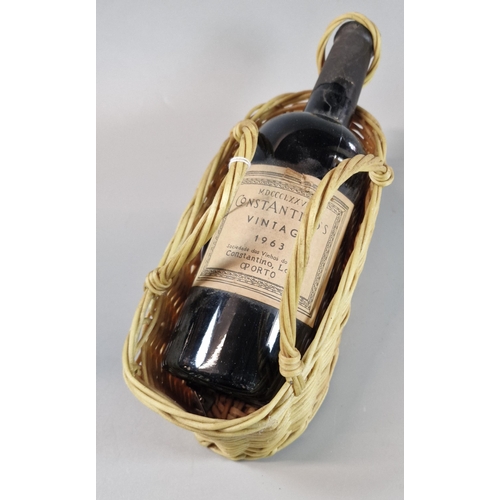 63 - Bottle of Constantino's vintage Port, 1963, in wicker bottle carrier. (B.P. 21% + VAT)