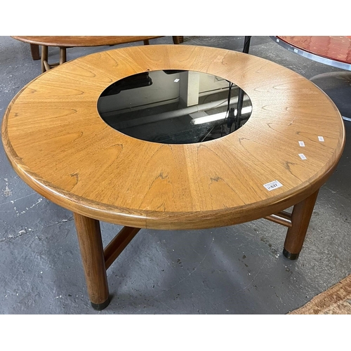 637 - G-Plan Mid century teak circular coffee table with smoked glass central panel on turned legs. 96cm d... 