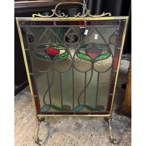 652 - Early 20th century Art Nouveau design brass framed lead glazed fire guard. 77cm high approx. (B.P. 2... 