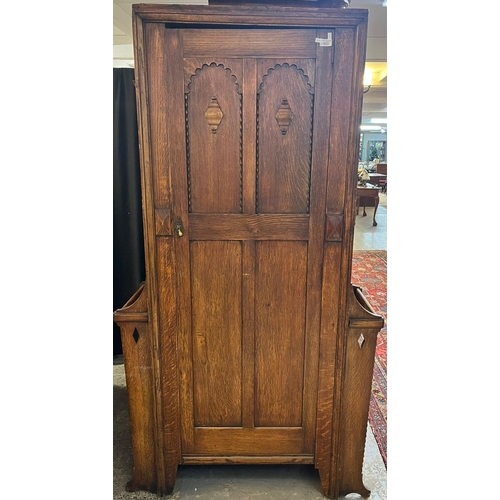 653 - Early 20th century oak hall wardrobe, with umbrella stands to each side. 104cm wide approx. (B.P. 21... 