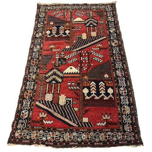 659 - Hand made Afghan Tribal vintage rug, on a red ground with stylized buildings and repeating geometric... 