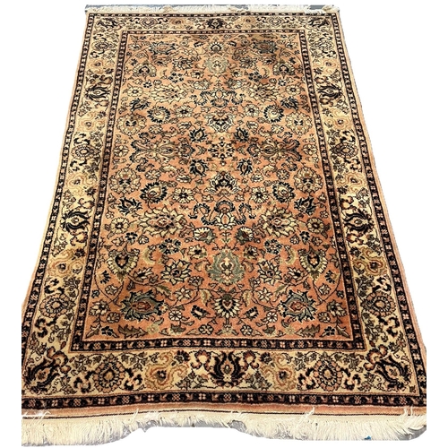 663 - Vintage peach and cream ground Middle Eastern design floral and foliate carpet. 195x120cm approx. (B... 