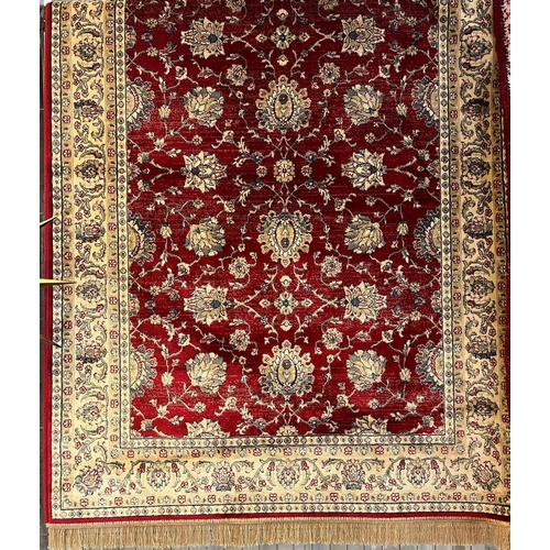 666 - Rich red ground full pile Kashmir rug, with floral Ziegler design. 178x117cm approx. (B.P. 21% + VAT... 