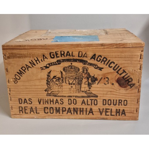 85 - Twelve bottles of Royal Oporto Das Vinhas do Alto Douro vintage Port 1983. In pine case marked 'Harr... 