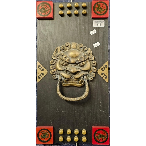 117 - Chinese panel with brass lion mask head and tablet mounts. 48x25cm approx. (B.P. 21% + VAT)