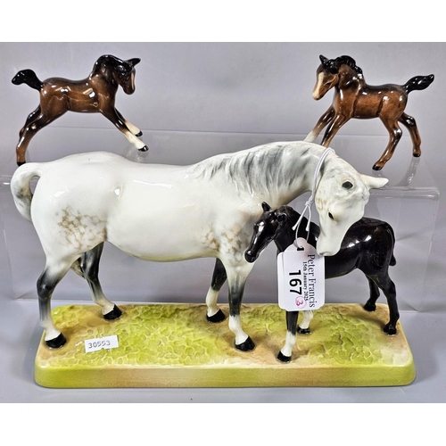 167 - Beswick 1811 horse and foal group, together with two Beswick foals. (3)  (B.P. 21% + VAT)