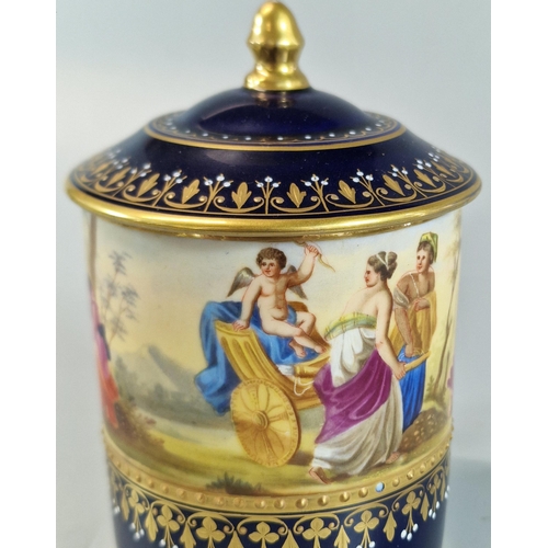 18 - Late 19th early 20th century Vienna porcelain chocolate cup and cover on a gilded and cobalt blue gr... 