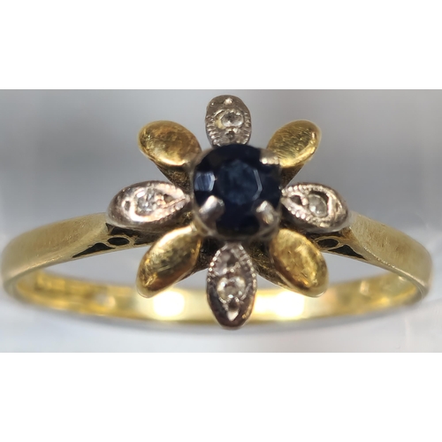 210 - 18ct gold diamond an sapphire flowerhead ring. 2.1g approx. Size N1/2. (B.P. 21% + VAT)